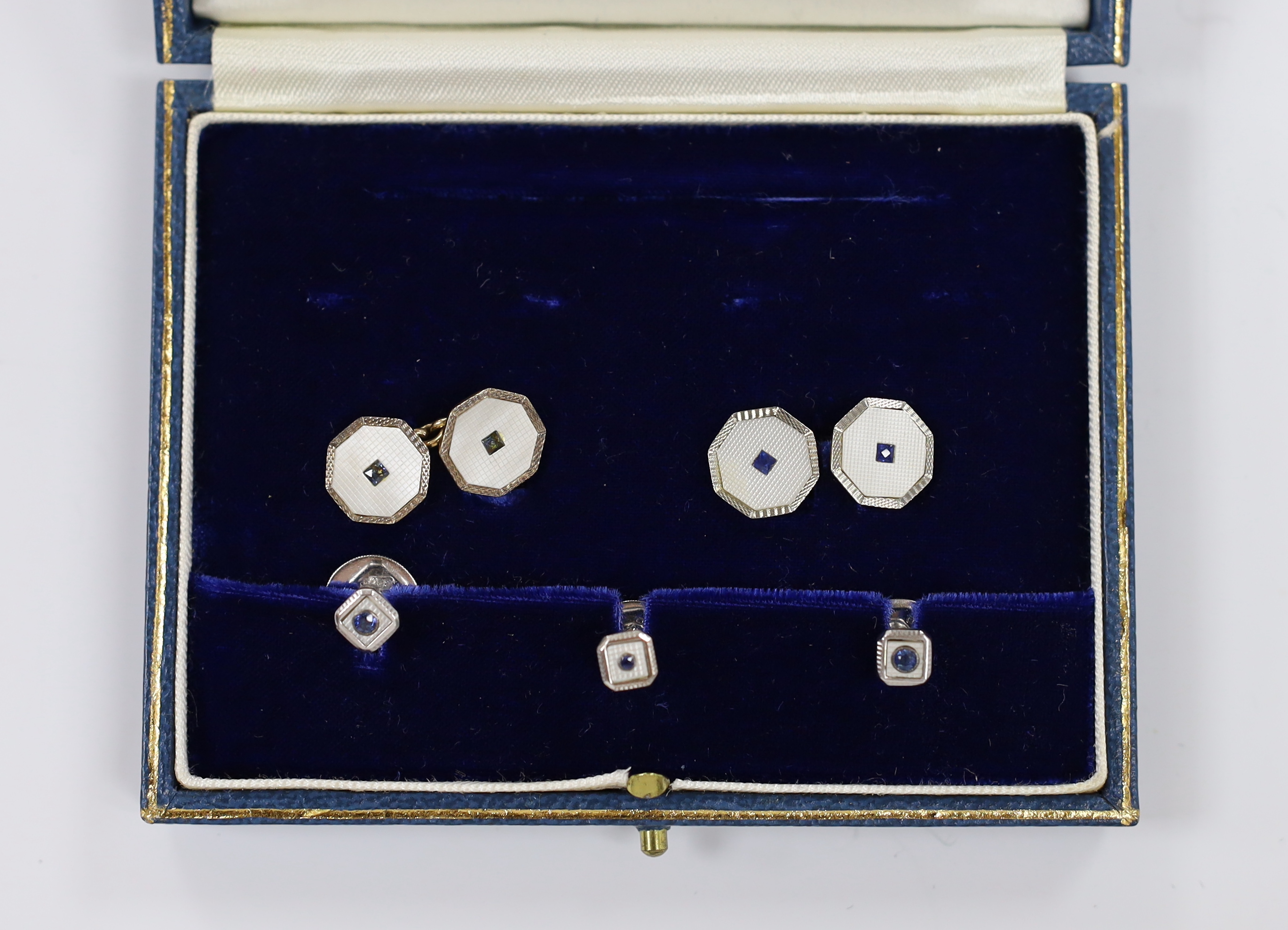 A cased matched 9ct, mother of pearl and blue stone set five piece cufflink and dress stud set.